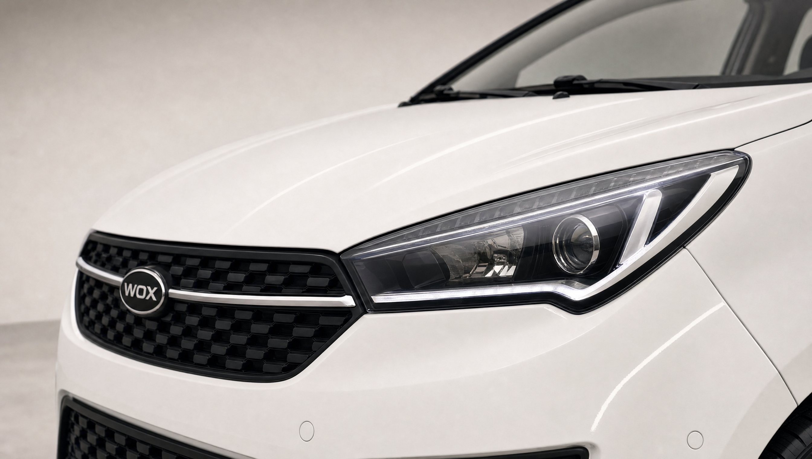WOX NOVA One — LED headlight and grille detail