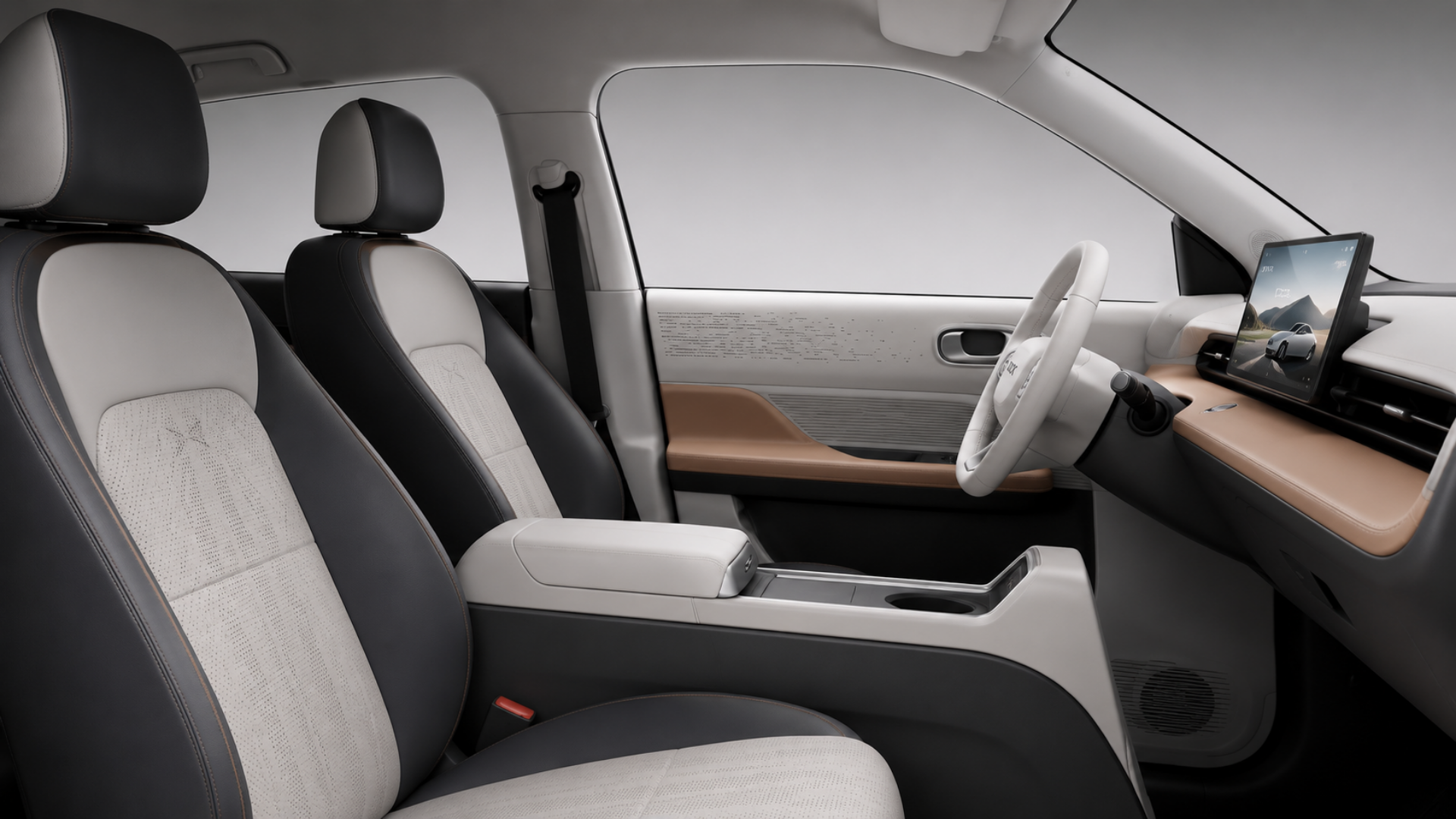 WOX Pixel interior — front seats with two-tone upholstery and WOX embossed headrests